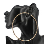 Textured metal hoop earring